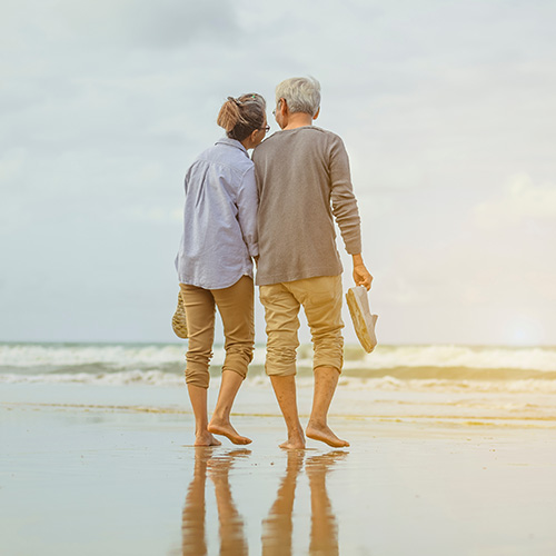 elderly couple on the beach